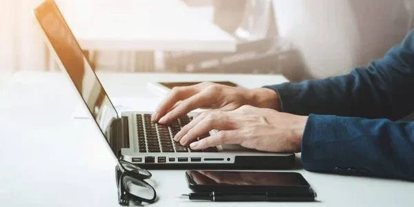 depositphotos_164977478-stock-photo-young-businessman-working-on-his